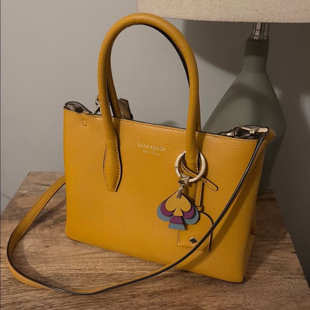 kate spade mustard yellow leather satchel with multicolor charm